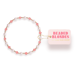 Gold, light pink, and pearl beaded bracelet. 