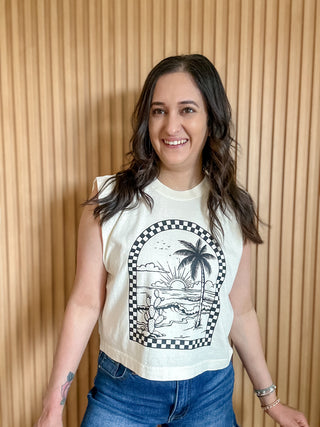 off white women's muscle tank with a black checkered arch design with beach scene on the inner part of the arch.