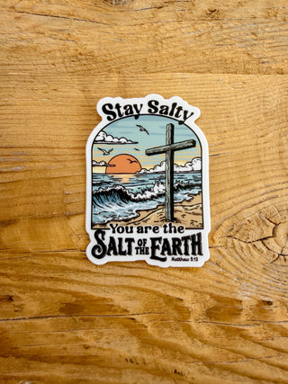 Sticker with a beach scene with a cross and the text Stay Salty You are the Salt of Earth Matthew 5:13
