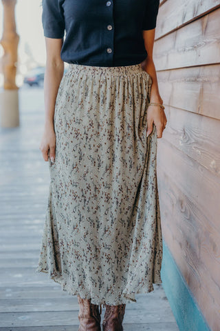 Floral textured skirt with a floral design, light olive background. 