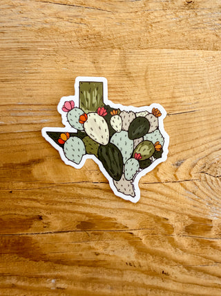 Sticker shaped like a Texas map with cactus design.