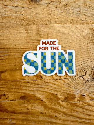 Sticker with 'Made for the Sun' text.