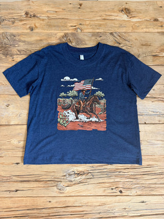 Navy tee with a graphic of a cowboy riding a horse with an American Flag. 