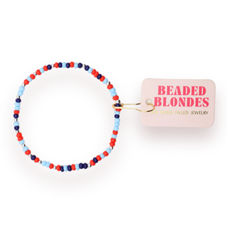 red, white, and blue beaded bracelet. 