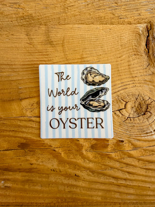 Sticker with 'The World is your Oyster' text and oyster illustrations. 