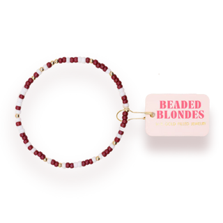 maroon, white, and gold beaded bracelet.