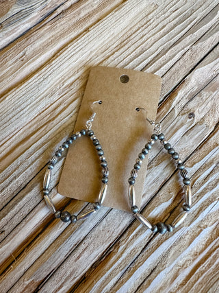 silver beaded teardrop shape dangle earrings. 