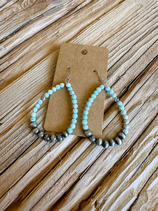 light blue/brown mix beaded and silver beaded teardrop shape dangle earrings. 