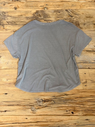 Back of Grey Brown Ribbed Short Sleeve Top. 