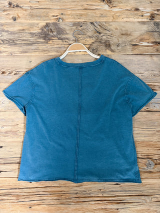 Back of Dark Teal V-Neck Top. 