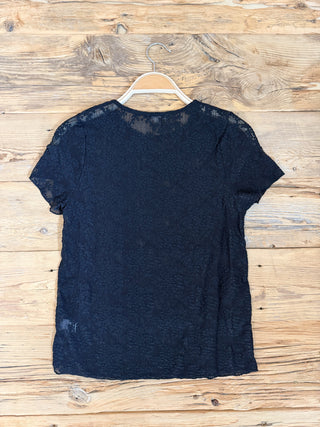Back of black lace short sleeve top. 