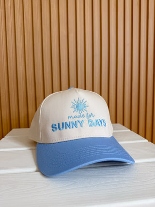 khaki and blue cap with 'made for SUNNY DAYS' embroidered text. 