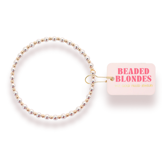 gold and silver beaded bracelet. 