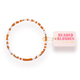 burnt orange, gold, and white beaded bracelet. 