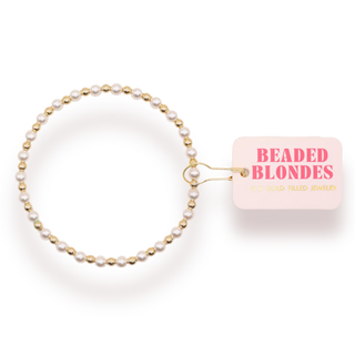 gold and silver beaded bracelet. 