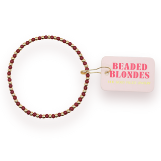 Gold and maroon beaded bracelet. 